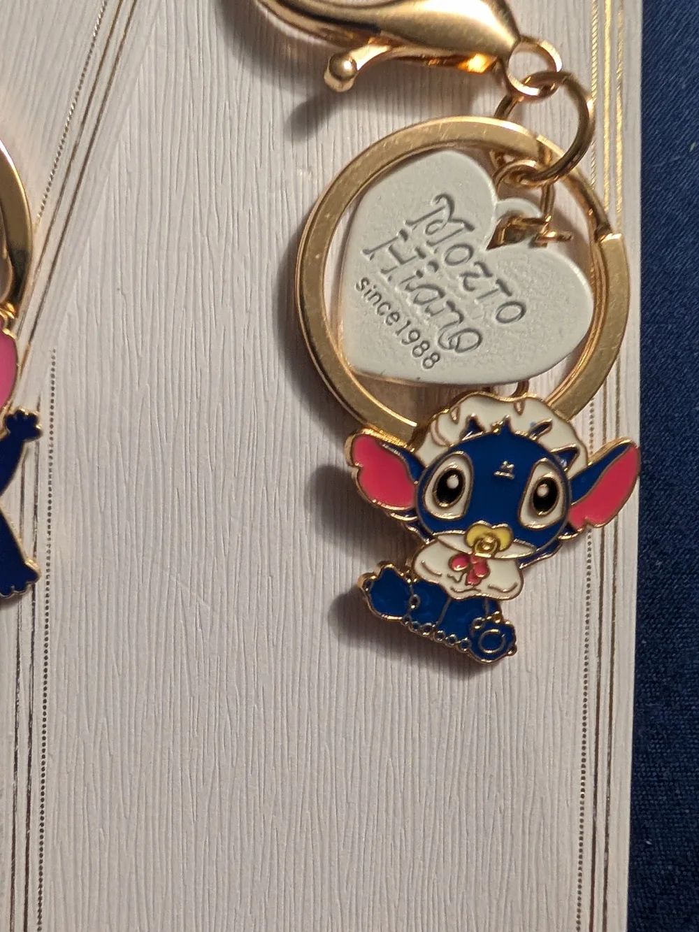 4 New Gold Keychain with Blue and Pink Stitch Character